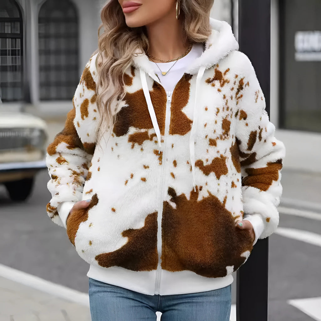 Yellow brown cow print hooded zip cardigan jacket on a hanger