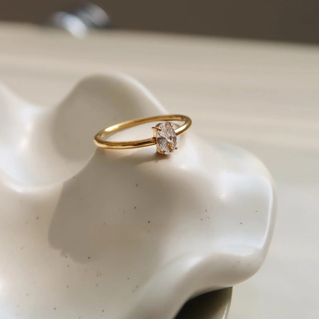 Golden stainless steel women's ring with love heart or oval centrepiece in sizes no.5 to no.8