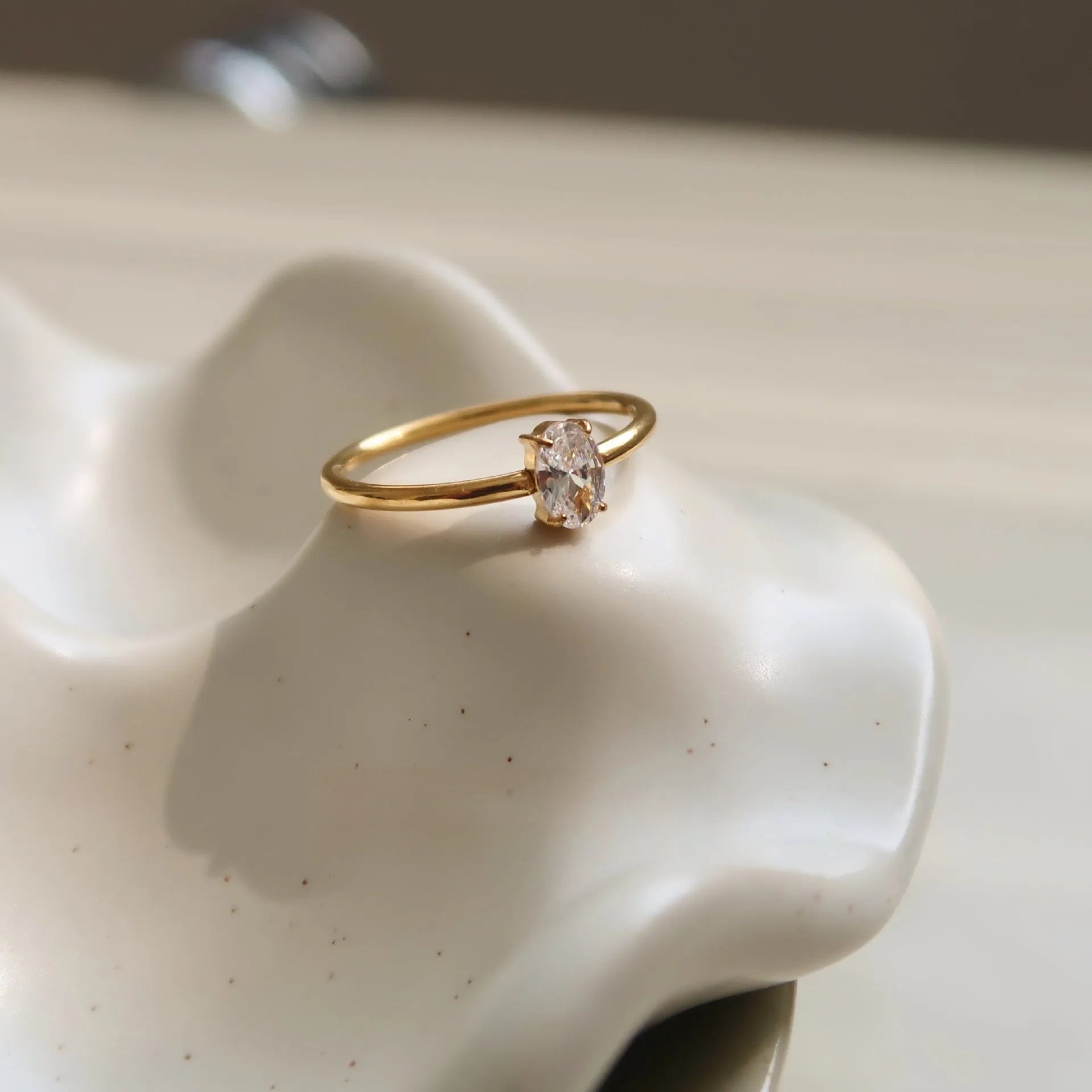 Golden stainless steel women's ring with love heart or oval centrepiece in sizes no.5 to no.8