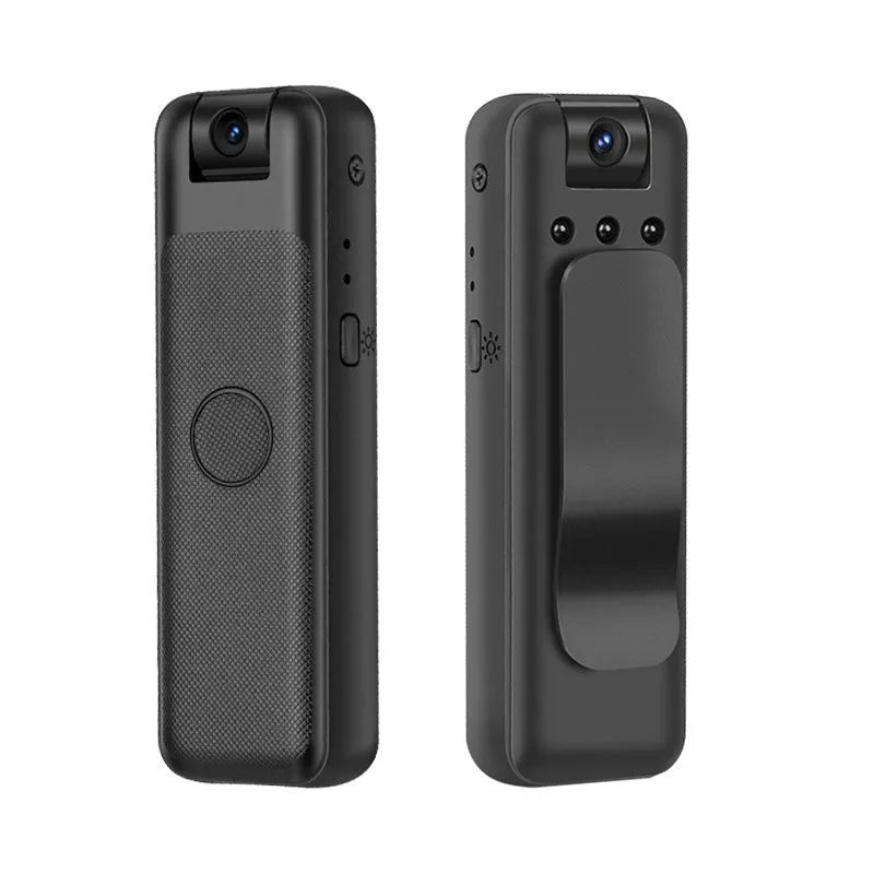 Black USB webcam on a desk with its sliding privacy cover partially closed over the lens.