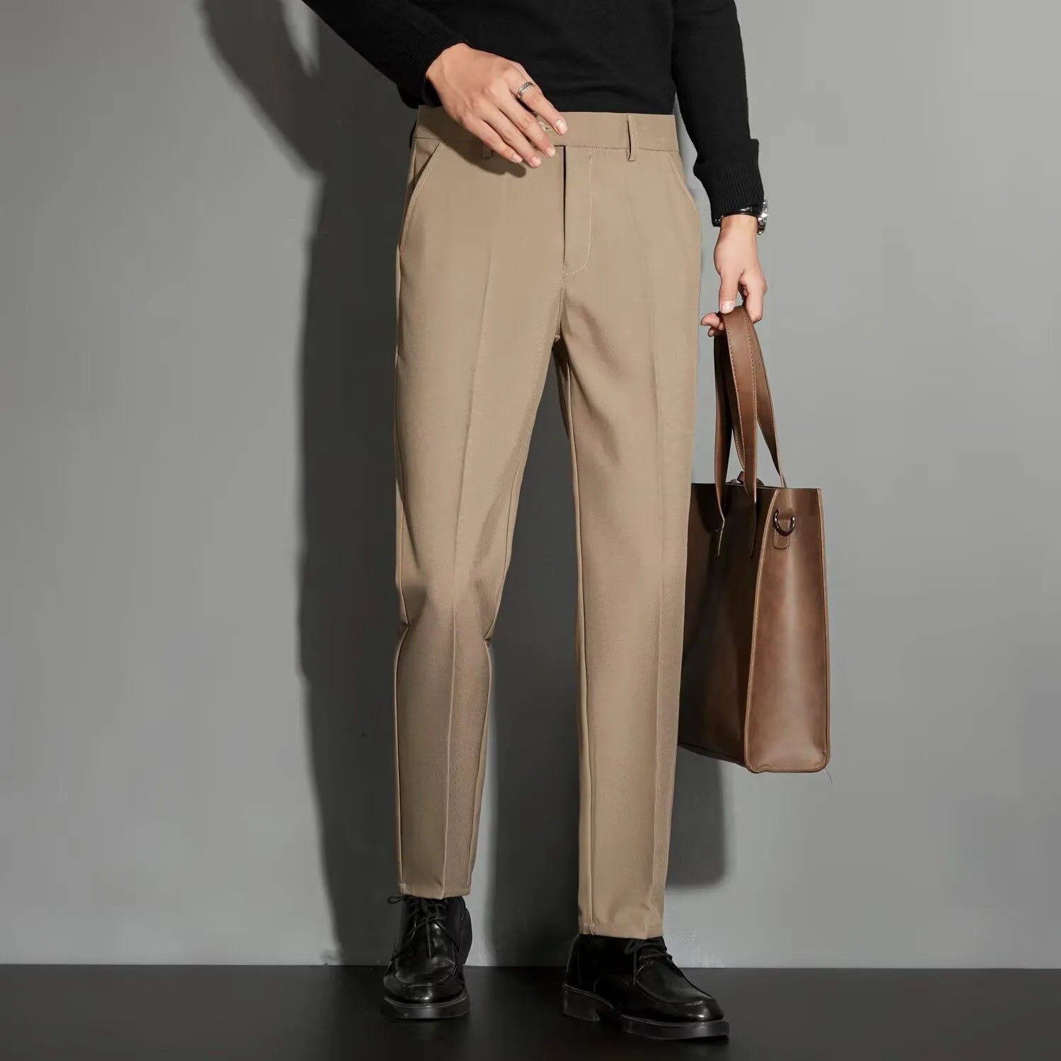Men's straight leg ankle-length suit trousers in apricot colour on a model