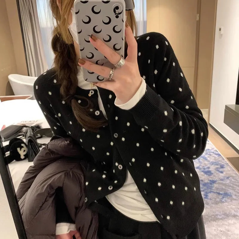 Women's gray dot pattern knitted cardigan with long sleeves and crocheted flower details