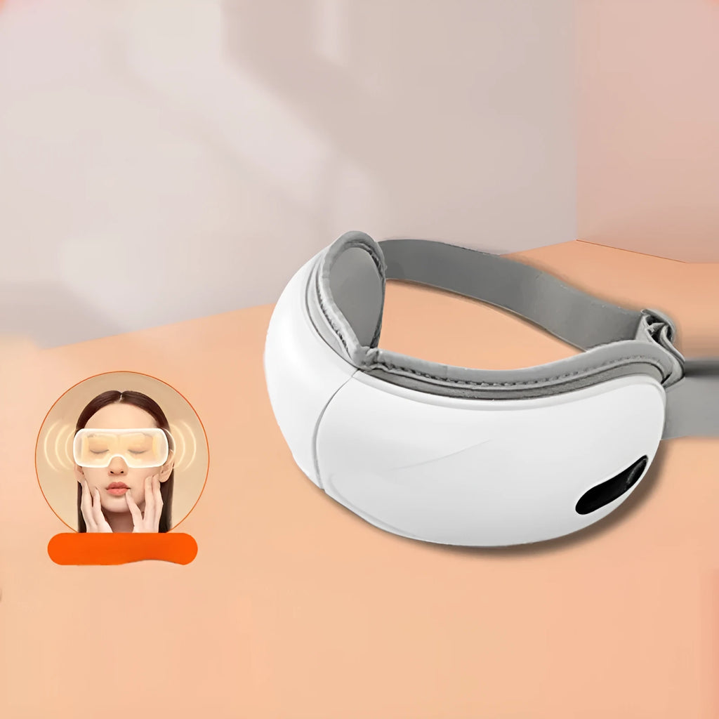 White rechargeable eye massager with airbag compression and hot compress functions for relieving eye fatigue