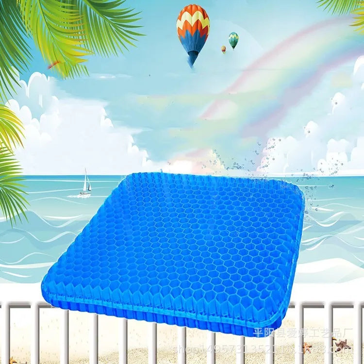 A blue breathable honeycomb gel seat cushion with a removable cover, shown on a wooden chair.