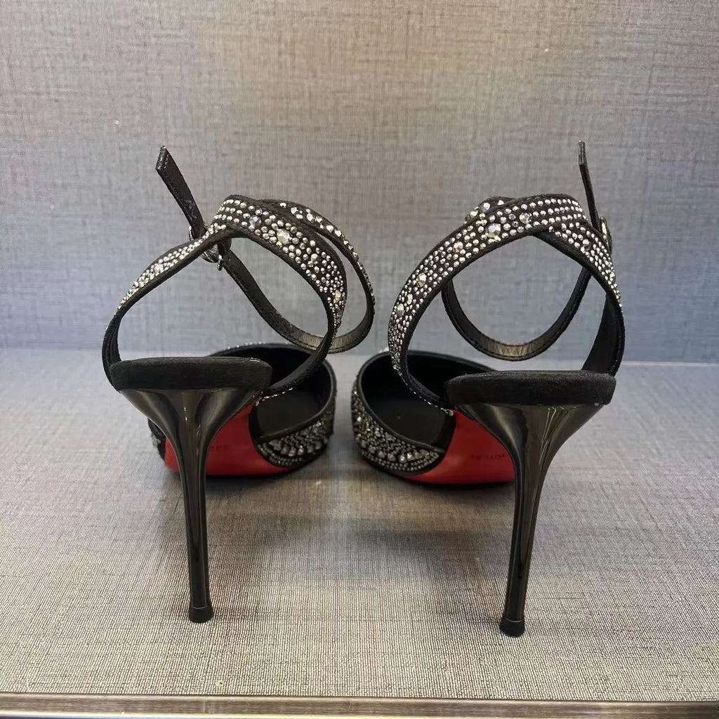 Women's black and silver hollow high heels with red soles, stiletto heels, and pointed toe design