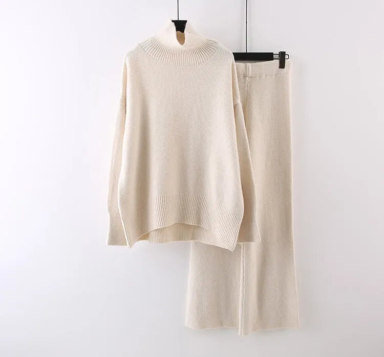 Women's casual two-piece set showing sweater and wide leg trousers in solid colour with thread detail