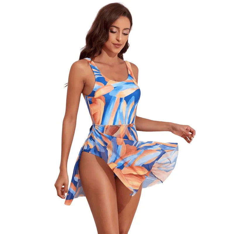 Women's single-shoulder one-piece swimsuit with colourful digital floral print and slim waist design.
