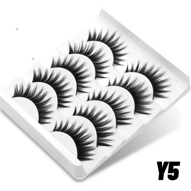 Box of natural false eyelashes with thick natural long style and adhesive tube