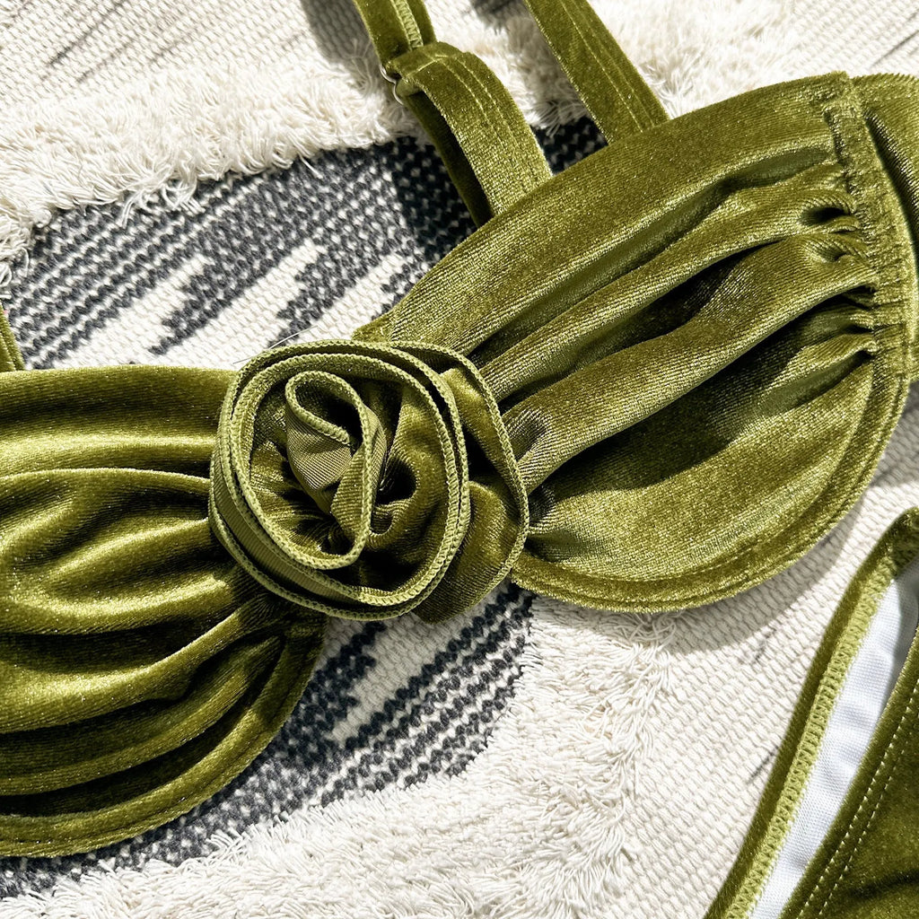 Women's 3D floral swimsuit briefs in green with matching bra, laid flat.