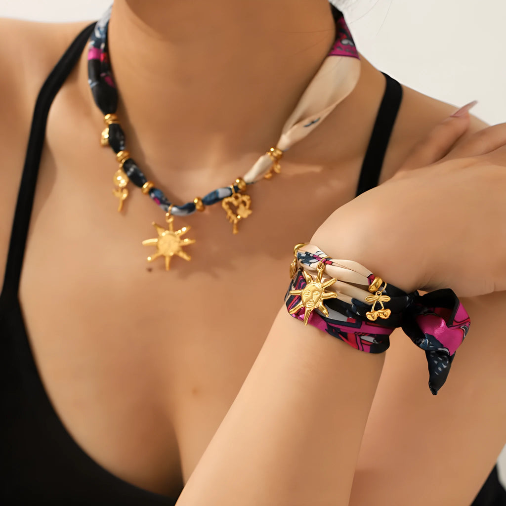 Children's stainless steel sunflower necklace and bracelet set in ins style on a light background