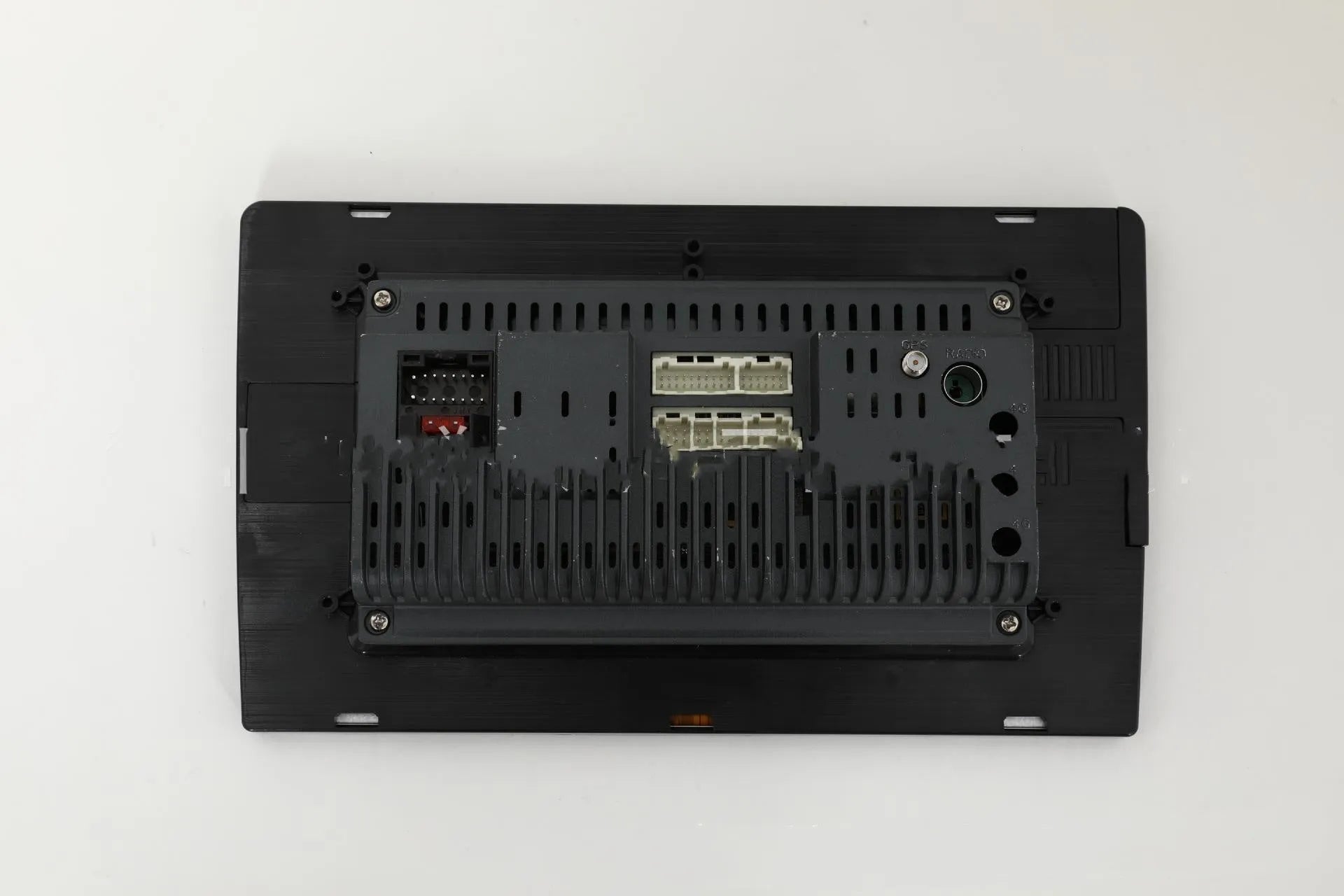 10.1 inch Android car head unit with touch screen, trapezoid panel design and universal fitting for vehicle dashboards