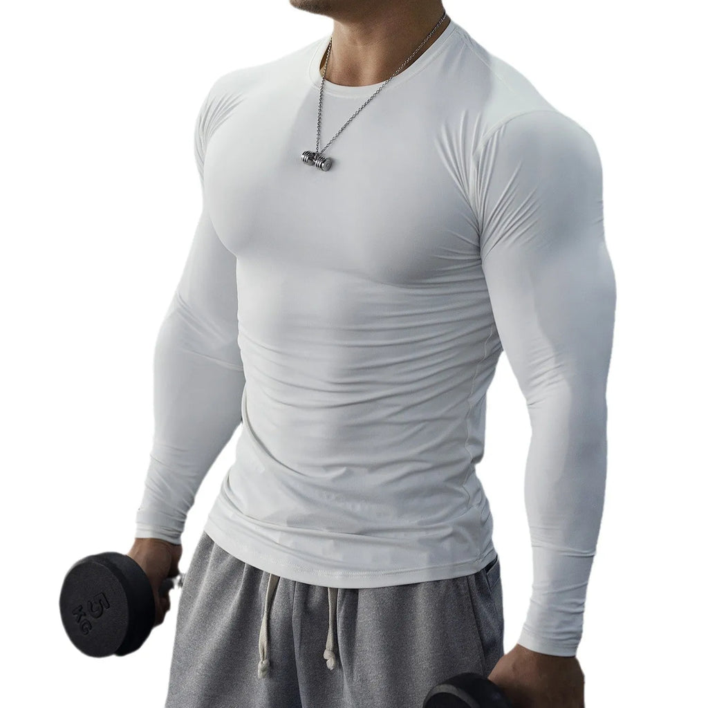 Man wearing a black slim-fit long-sleeved fitness top for running or gym workouts.