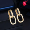 Pair of copper earrings with inlaid zircon, U-shaped geometric buckle design in white gold colour