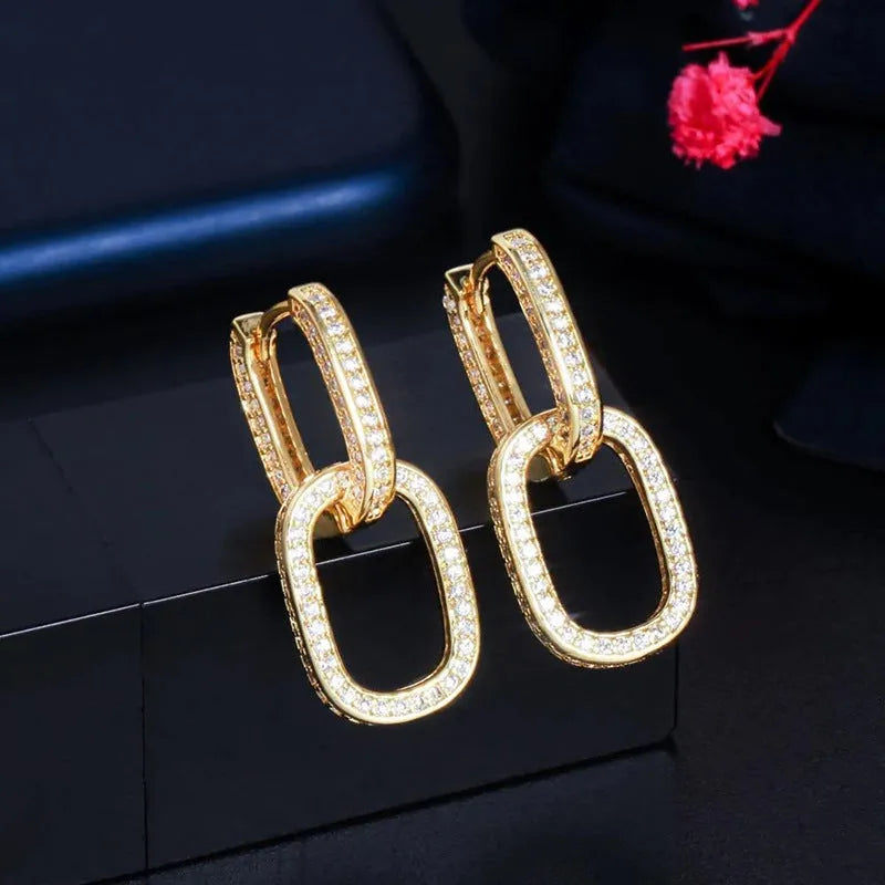 Pair of copper earrings with inlaid zircon, U-shaped geometric buckle design in white gold colour