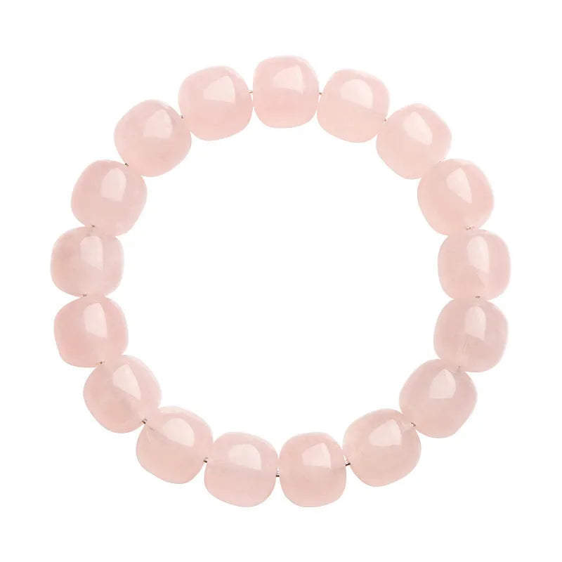 Pink crystal barrel bead bracelet with natural bamboo elements and geometric design