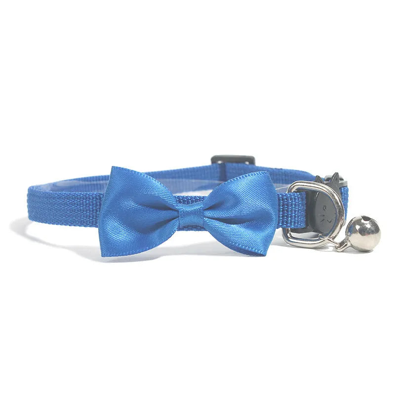 Striped multi-colour adjustable nylon cat collar with a small bell attached.