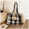 Wool plaid women's single-shoulder commuter bag in brown with stitched seam detailing and double straps