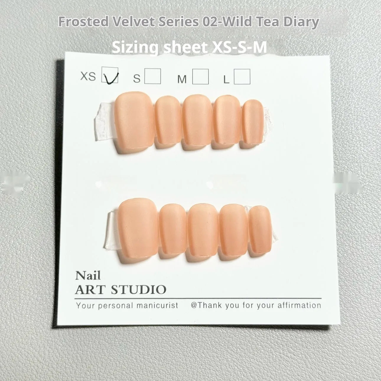 Frosted velvet cat's eye aurora design artificial nail art set in short ladder XS, S, and M sizes.