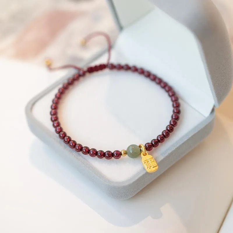 Hand-woven red rope bracelet with strawberry quartz crystals in minimalist national tide style