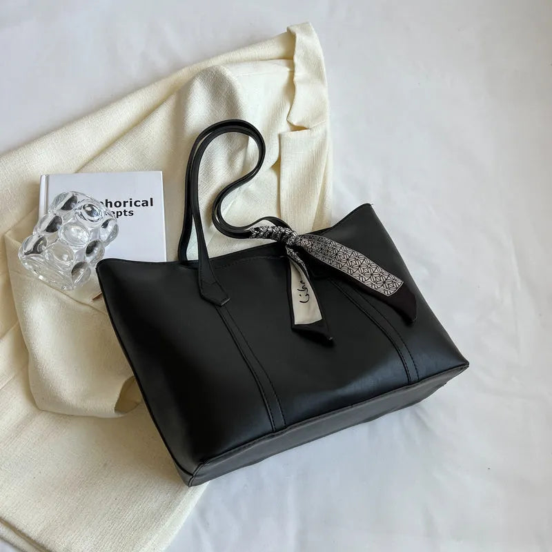 Canvas bucket tote bag with crossbody strap showing sandwich pocket organisation and soft construction