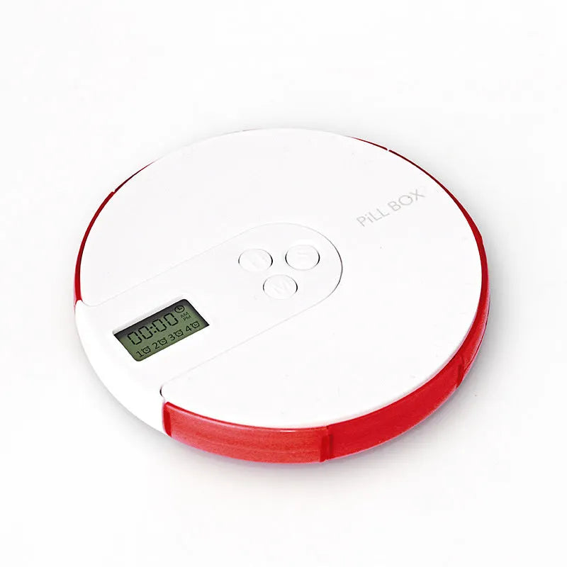 Blue seven-compartment alarm clock pill dispenser with digital display, shown next to pills.