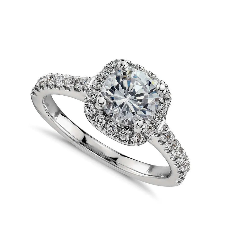 Geometric sculpted platinum alloy ring with diamond insert on white background