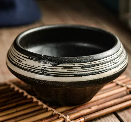 Ceramic Japanese soup bowl with stone conch shape and traditional Edo pattern design