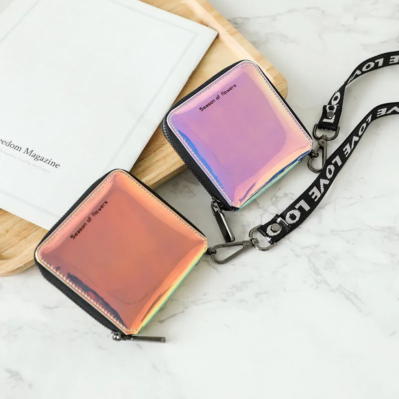 Women's short folding Korean-style wallet in glitter blue or green colours showing 11cm dimensions