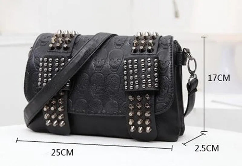 Black leather messenger bag with skull rivets and buckle closure for women