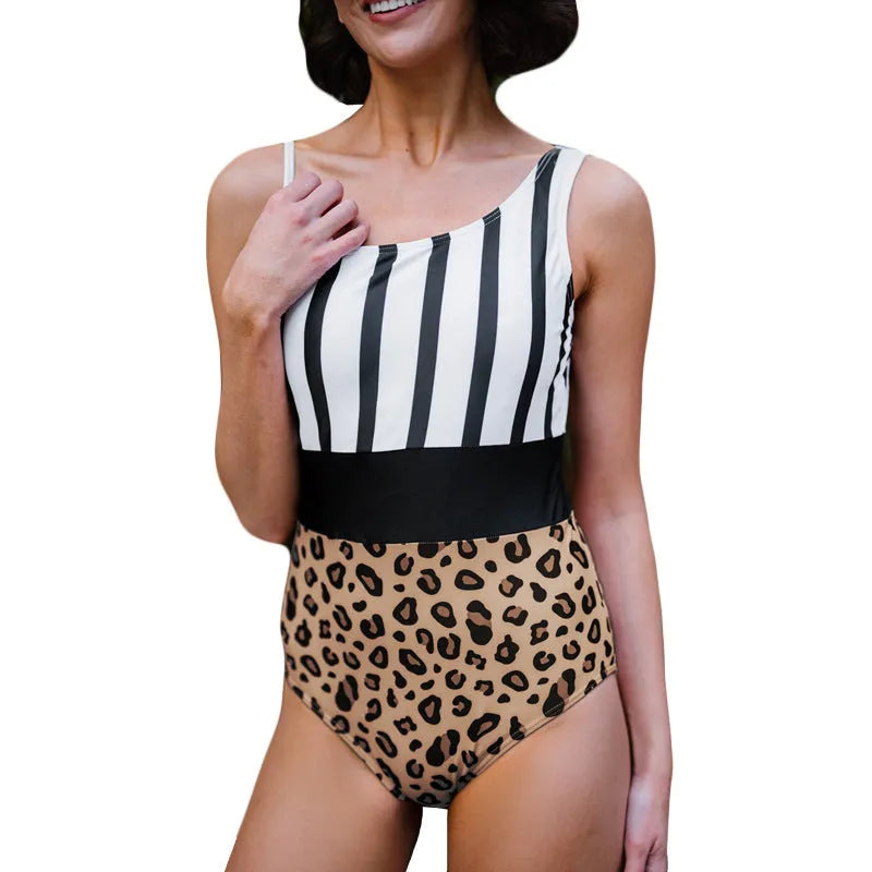 Leopard print women's one-piece swimsuit with an asymmetric collar and high waist on a mannequin