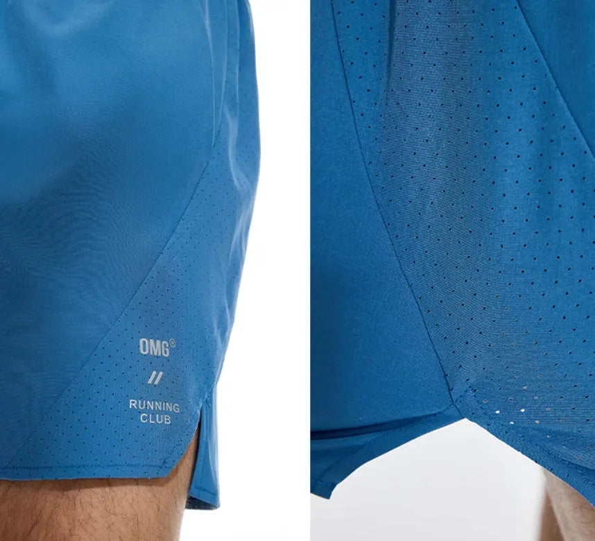 Men's black running shorts with laser stitching on a grey background, showing stretch fabric.