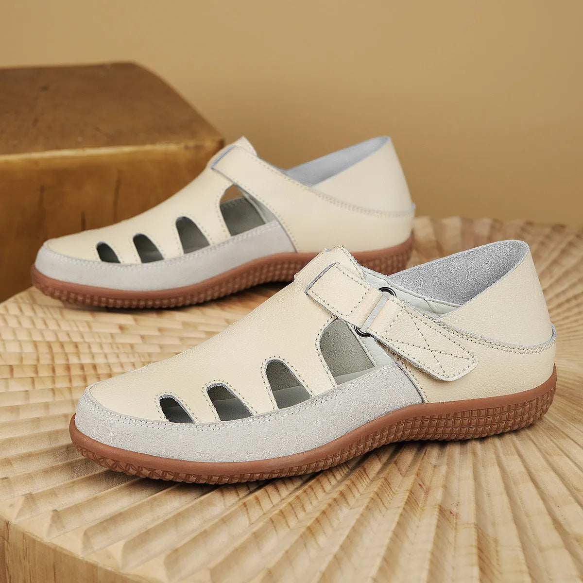 Women's plus size flat heel sandals with hollow toe cap in blue, red, or white on a thick rubber sole.