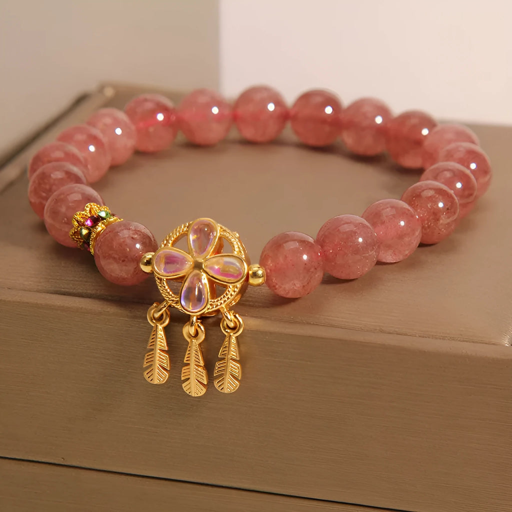 Women's bracelet with strawberry quartz dream catcher pendant on wrist