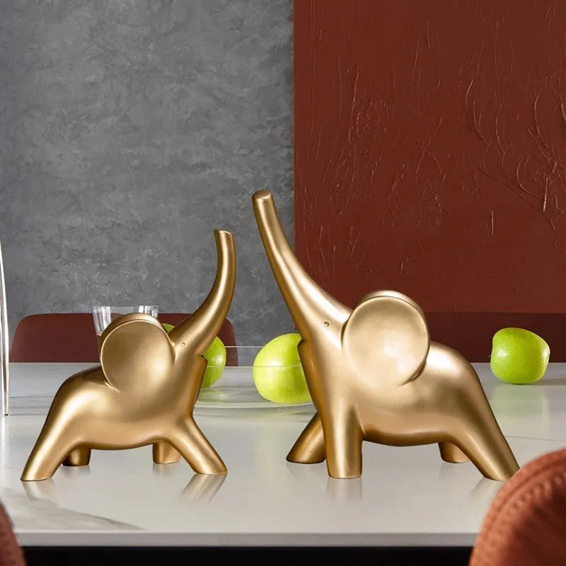Modern resin elephant ornament in rose gold or white colour, available in large and small sizes.