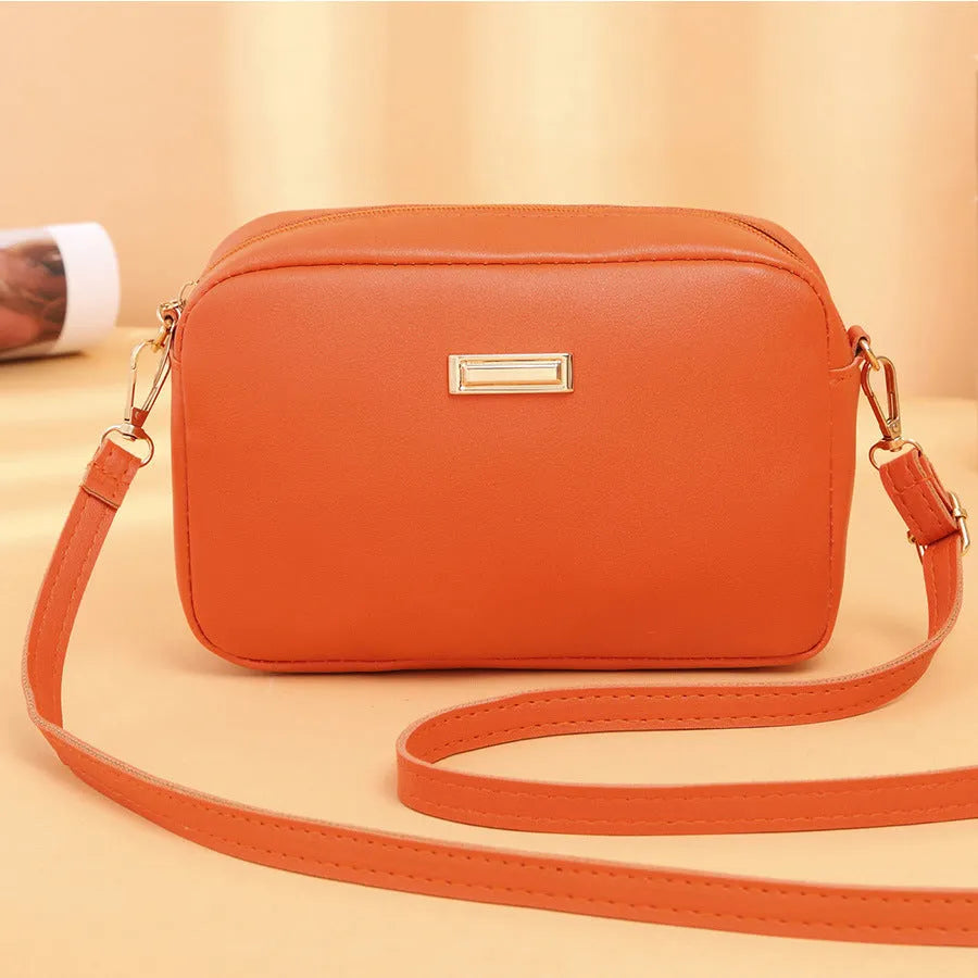 Solid colour PU women's shoulder bag showing three-dimensional pocket, in horizontal square shape.