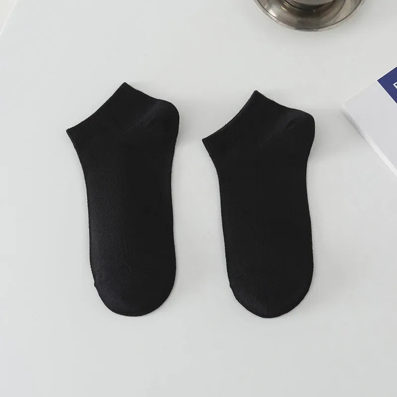 Solid colour low-cut boat socks for men made from polyester, shown in one of six available colours.