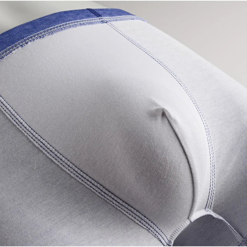 Cotton men's body sculpting boxer briefs in light blue with breathable knit and hip lift design