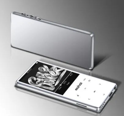 Black portable MP3 MP4 player with 2.4-inch touch screen showing music interface, placed on a desk.