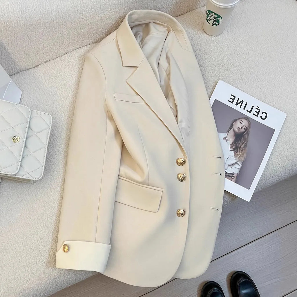 Korean-style loose-fit women's coat in beige and black, showing long sleeves and pockets.