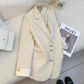 Korean-style loose-fit women's coat in beige and black, showing long sleeves and pockets.