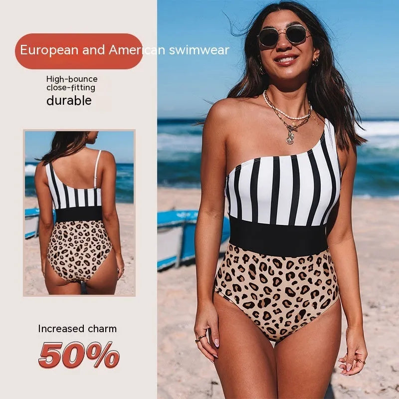 Leopard print women's one-piece swimsuit with an asymmetric collar and high waist on a mannequin