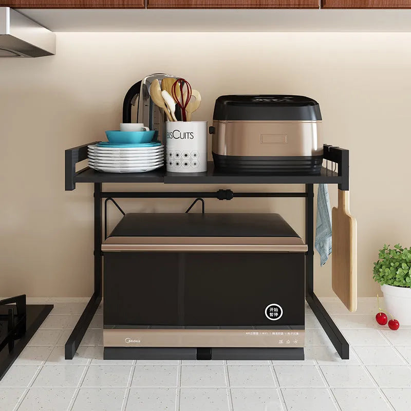 Retractable metal kitchen microwave rack with two layers on a countertop