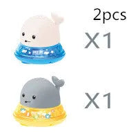 Automatic water-sensing whale bath toy with spray, lights, and music functions for baby bath time