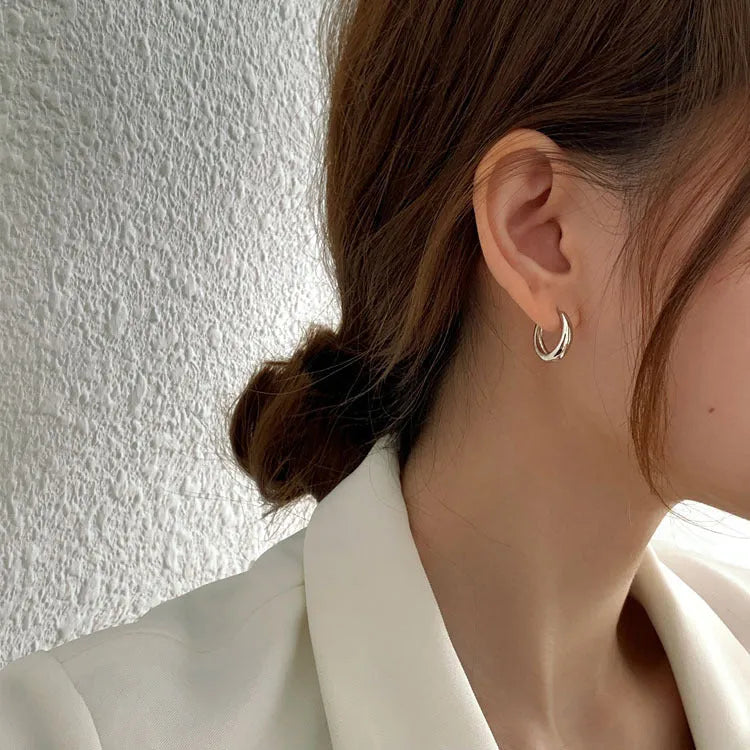 Geometric water drop earrings in gold or silver on a copper base, shown in small, medium, and large sizes.
