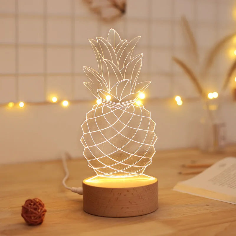 Wood and acrylic dimmable pineapple-shaped USB night light on a table.