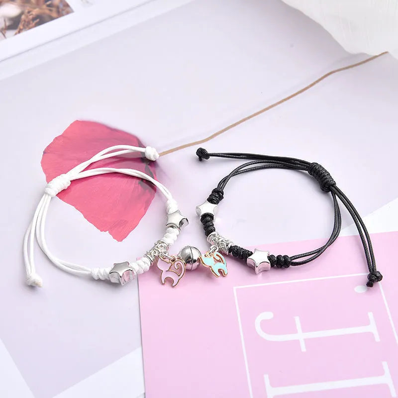 Magnetic clasp couple bracelets with alloy construction and symbolic designs including crown and love lock motifs.