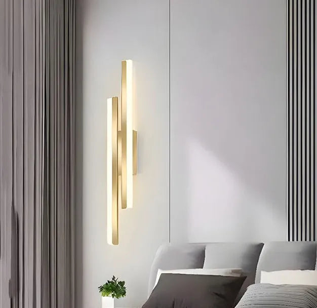 Modern gold double line wall lamp mounted on a wall, showing its 500mm length and artistic design for background lighting.