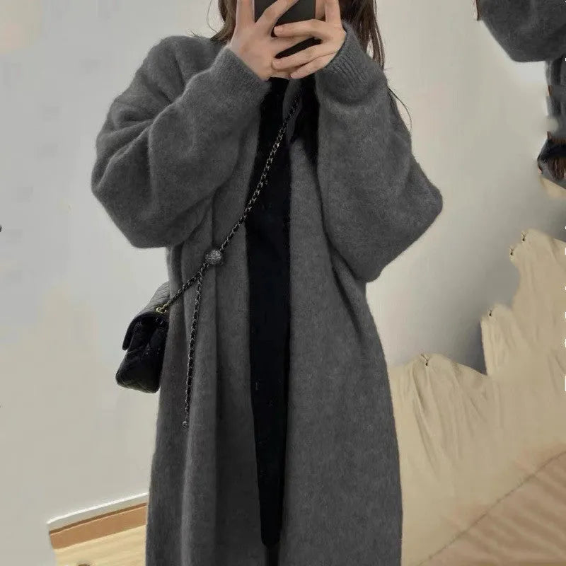Loose thick chenille cardigan for women in a dark grey colour, showing 3D pattern and mid-length fit.