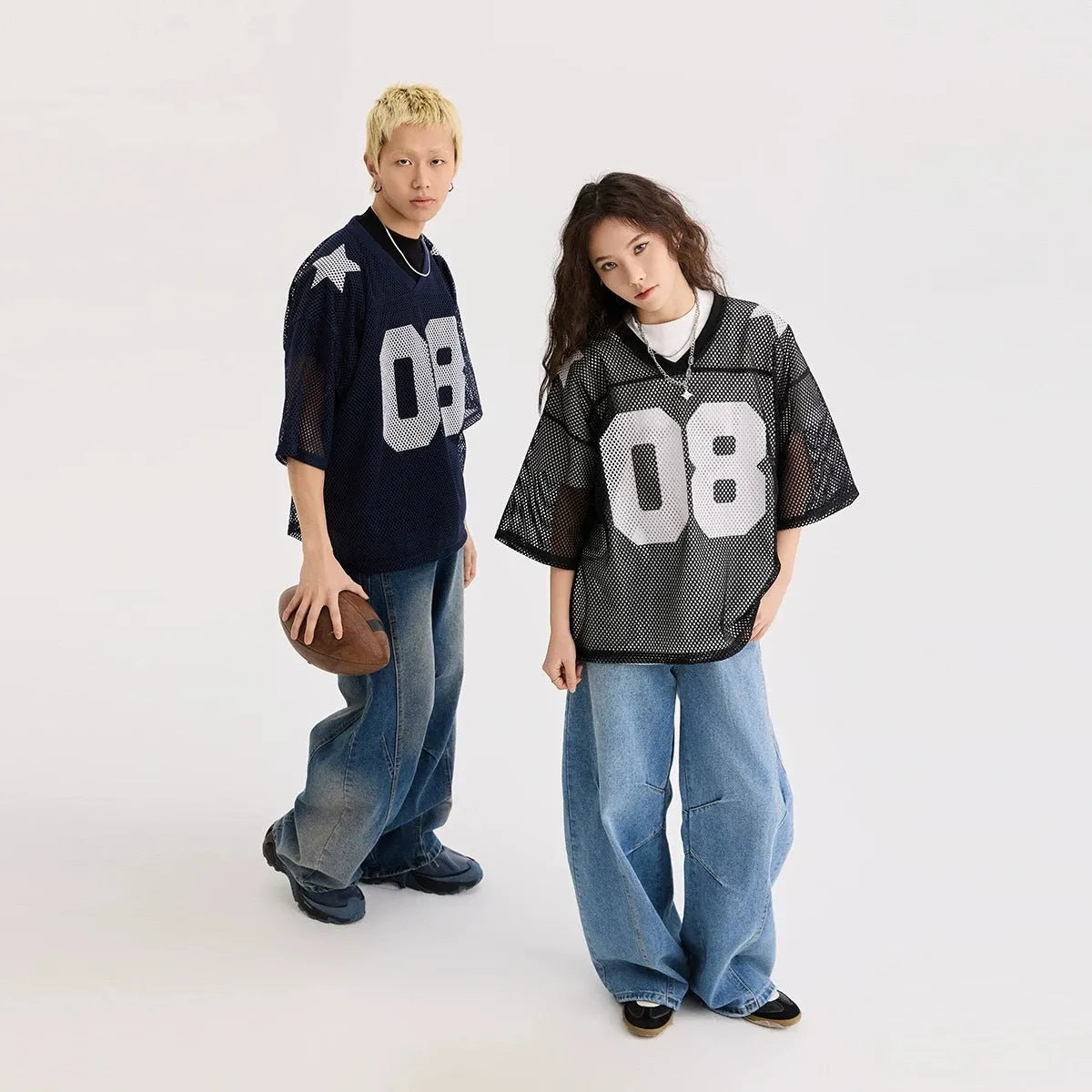 Letter pattern pullover shirt in loose fit with short sleeves available in black or navy blue