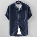 Men's loose fit short sleeve shirt in a cotton linen blend fabric, shown in a solid colour.